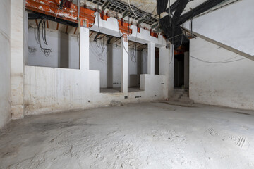 A place under construction with raw walls and corrugated pipes to channel the wiring with...