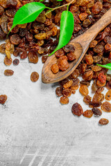 Raisins with green leaves.