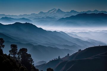 Fototapeta View of the Himalayan mountain range from the Khalia Top Trek trail with outlines of the mountains visible through the vibrant fog. Khalia Top is located in India's Kumaon area of the Himalayas, at an obraz