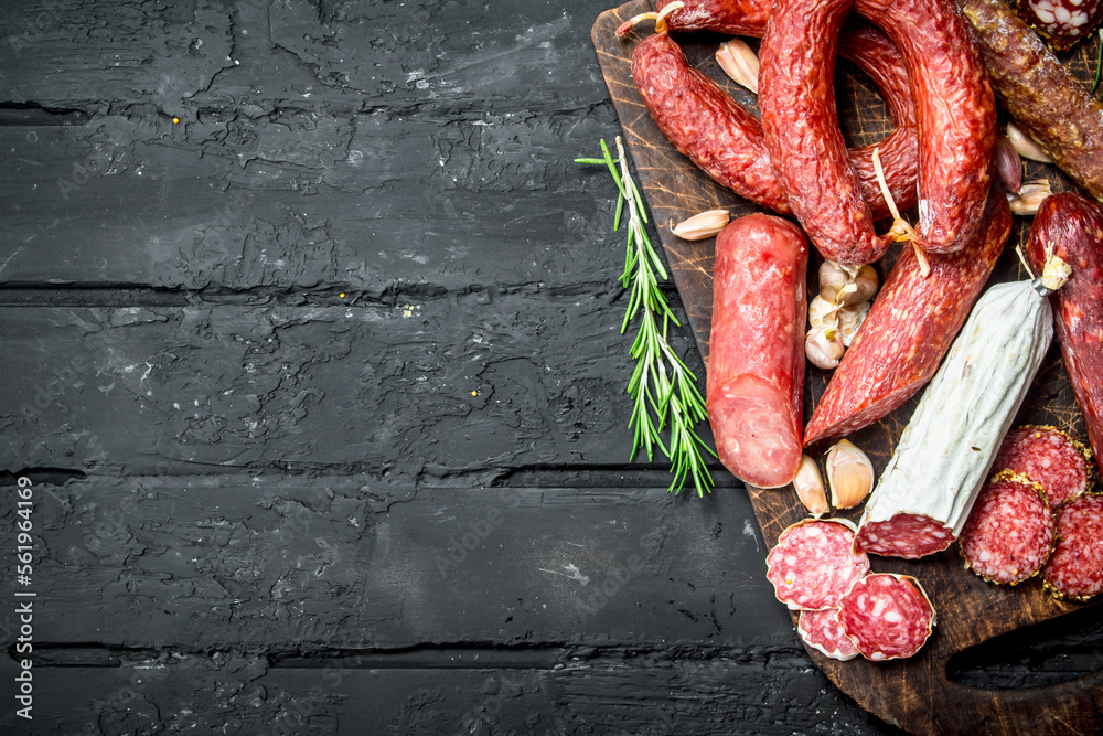 Poster different types of salami with spices and herbs.