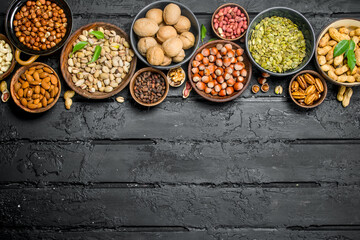 Assortment of different nuts in bowls.