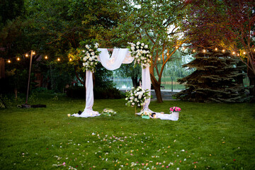 very beautiful wedding arch of the newlyweds in nature
