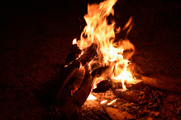 The yellow fire is a burning bonfire, a blazing firewood.
