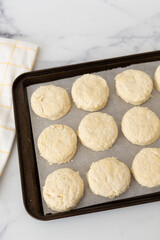 Raw Homemade Buttermilk Biscuits on Baking Sheet