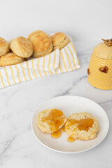 Close-up of Freshly Baked Homemade Buttermilk Biscuits with Honey