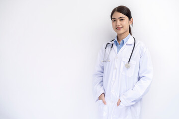 Fototapeta premium Portrait of female doctor in medical coat standing on isolated white background