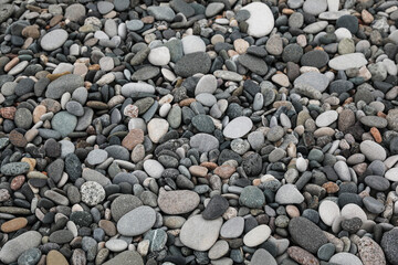 Surface covered with many different pebbles as background
