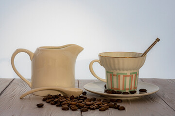 Still life with coffee beans and cup