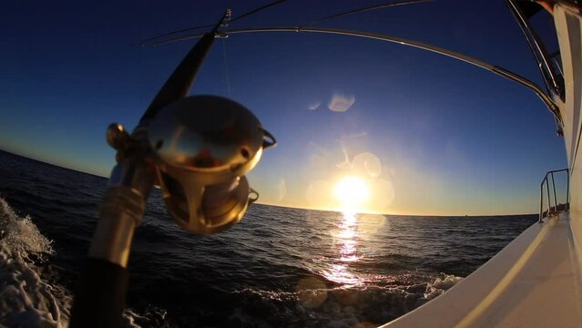 Deep Sea Fishing Reel Ocean Sunset Trolling Boat