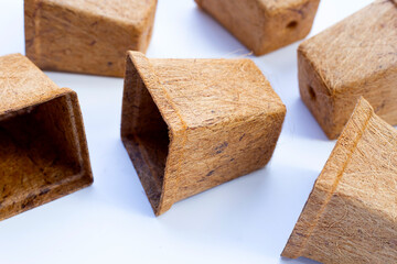 Coco coir pots on white background.