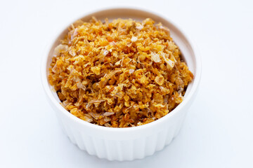 Dried chopped garlic on white