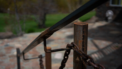 old rusted railing with chain 