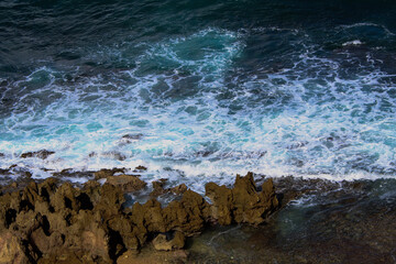 rocky coastline with waves crashing