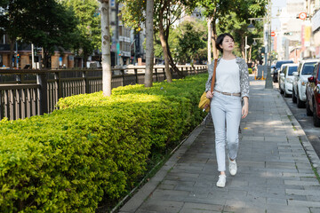 Fototapeta na wymiar Full length body short haircut Asian attractive carefree cheerful girl walking traveling on fresh air outdoors