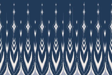 Ikat ethnic blue-white pattern. Illustration ikat chevron blue-white color seamless pattern background. Ikat pattern use for fabric, textile, home interior decoration elements, upholstery, wrapping.