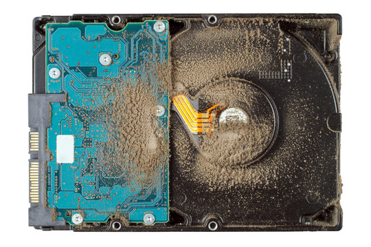 A dusty computer hard drive. Old hard drive on a white background. Repair and maintenance of the computer.