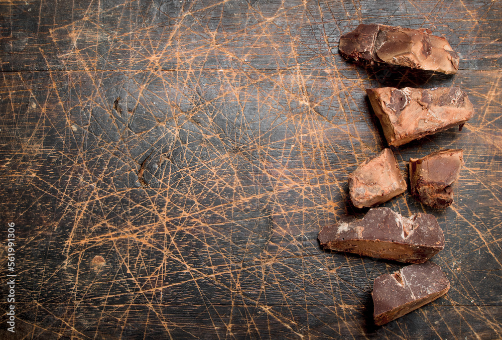 Wall mural Pieces of dark chocolate.