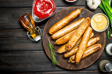 Fragrant grilled sausages with sauces and herbs.