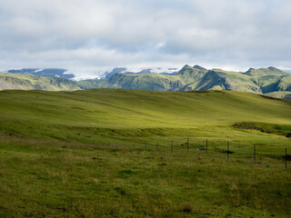 Green pastures and mountains along the Ring Road near Vik, Iceland