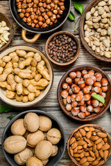Assortment of different nuts in bowls.