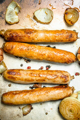 Fried sausages with garlic and onions.