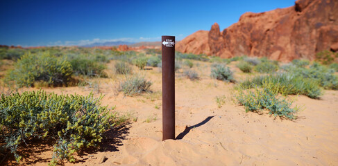 STAY ON TRAIL sign in sandstone formations of Valley of Fire State Park, Nevada, USA.