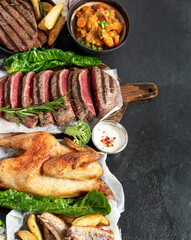 Various food. Meat dishes and vegetable dishes. Menu. Food on the plates.