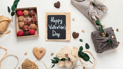 Valentine's Day Zero Waste Concept. Eco-friendly linen packaging as a gift for Valentine's Day in furoshiki style. Simple eco presents plastic free.