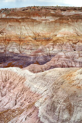 Striped purple sandstone formations of Blue Mesa badlands in Petrified Forest National Park, Arizona, USA.