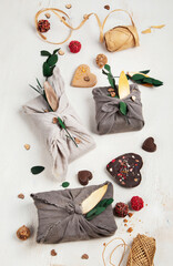Valentine's Day Zero Waste Concept. Eco-friendly linen packaging as a gift for Valentine's Day in furoshiki style. Simple eco presents plastic free.