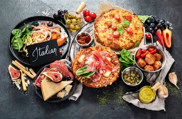Dinner table of italian meals dishes.