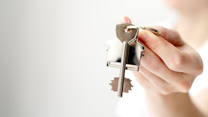 Excited young hispanic lady tenant buyer wish to keep in memory moving to new home take selfie on phone with keys in hand. Happy woman proud of buying flat make video call to friend show key to camera