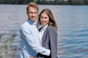 young couple in love standing together on the shore .