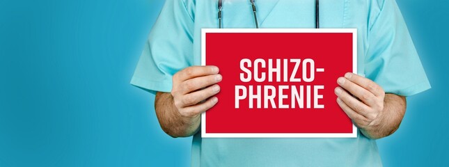 Schizophrenie. Arzt hält rotes Schild mit medizinischen Text zur Diagnose der Krankheit.