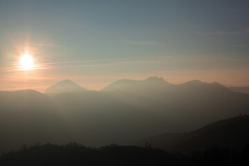 sunset in the Carpathian mountains on a foggy evening