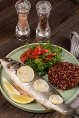 Baked sea bass with brown rice and fresh salad