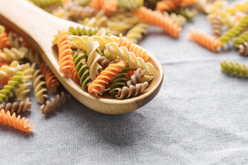 A variety of fusilli pasta made from different types of legumes, green and red lentils, mung beans and chickpeas. Gluten-free pasta.