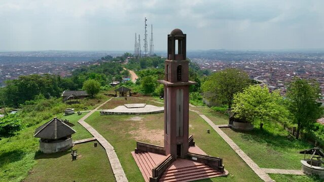Forward drone shot of Bower's Tower on a hilltop in Ibadan, Nigeria
