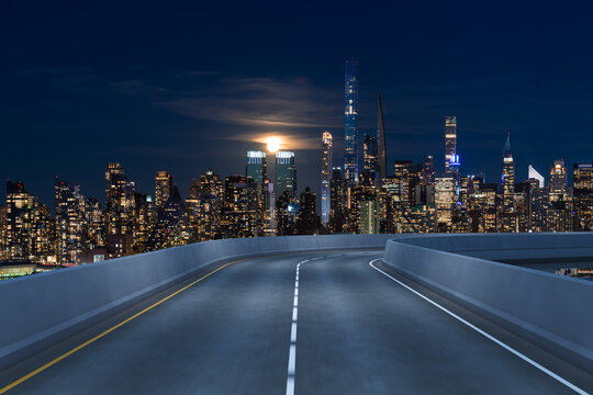Empty urban asphalt road exterior with city buildings background. New modern highway concrete construction. Concept of way to success. Transportation logistic industry fast delivery. New York. USA. © VideoFlow