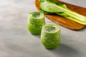 Spinach smoothie on a table.
fresh smoothie image.