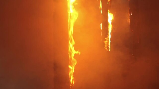 Background image of a house burning with a bright flame. Fire.