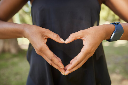 Hands, Heart Sign And Fitness With A Yoga Black Woman Outdoor For Meditation, Mental Health Or Wellness. Nature, Peace And Park With A Female Athlete Meditating Outside For Loving Peace Or Balance