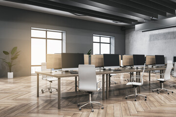Luxury dark concrete and wooden coworking office interior with furniture, equipment, window with city view and sunlight. Workplace and loft space concept. 3D Rendering.