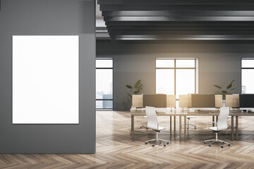 Modern dark concrete and wooden coworking office interior with empty mock up banner on wall, furniture, equipment, window with city view and sunlight. Workplace and loft space concept. 3D Rendering.