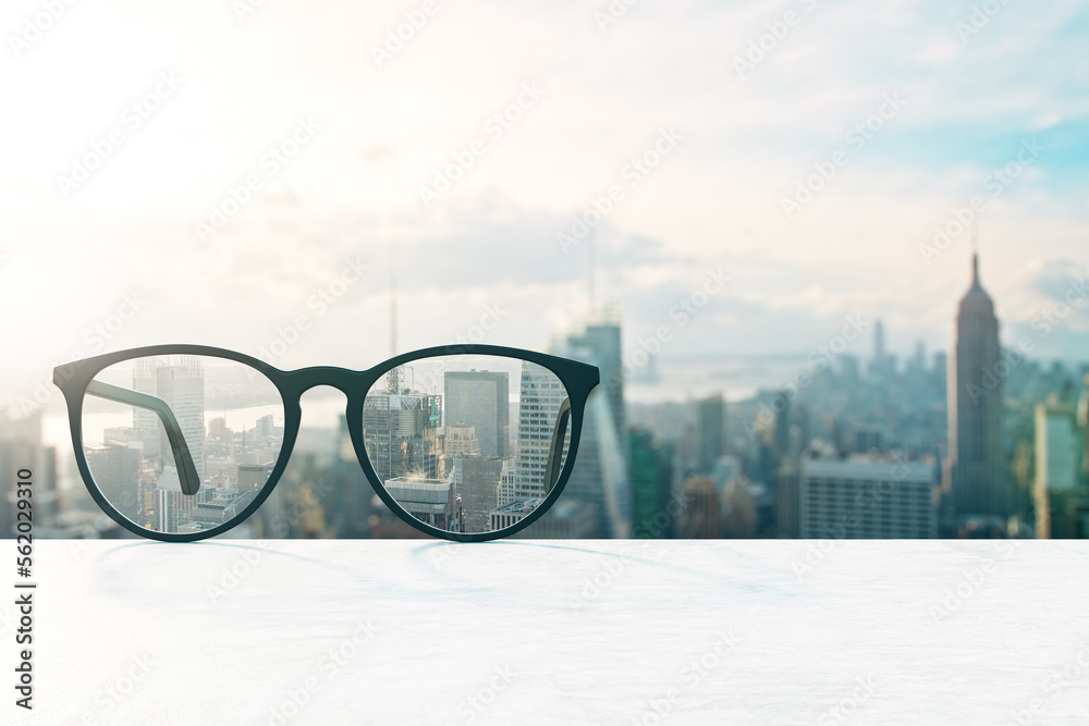 Poster look through glasses at blurred city with mock up place on sky wallpaper. vision and perspective con