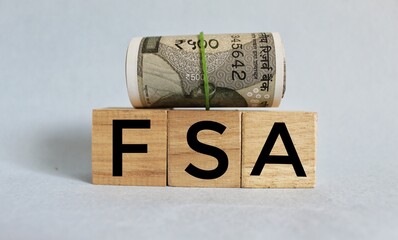 FSA word on wood blocks concept, Flexible Spending Account concept. 