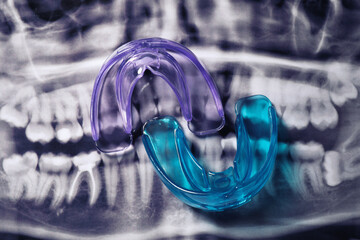 Mouth guards on dental scan, flat lay. Bite correction