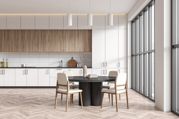 Front view on bright kitchen room interior with dining table