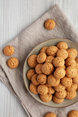 Homemade Italian Amaretti Cookie Biscuits on a Plate, top view. From above, overhead, flat lay.