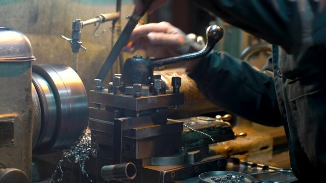 The work of a turner on a lathe.
